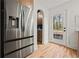 Modern kitchen boasts stainless refrigerator, with pantry and door to outside patio at 2433 Helmsdale Ne Dr, Atlanta, GA 30345