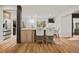 Modern kitchen with stainless steel appliances, a center island with barstool seating, and hardwood floors at 2433 Helmsdale Ne Dr, Atlanta, GA 30345