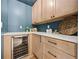 Stylish pantry with built-in wine cooler, countertop space, and custom cabinetry for ample storage at 2433 Helmsdale Ne Dr, Atlanta, GA 30345
