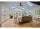 Bright sunroom with hardwood floors, large windows, skylights, and views of the outdoors at 2433 Helmsdale Ne Dr, Atlanta, GA 30345
