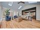 Bright sunroom featuring hardwood floors, stylish furniture, and oversized windows at 2433 Helmsdale Ne Dr, Atlanta, GA 30345