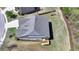 The house is in a tranquil setting with an expansive yard and a wooden deck offering an ideal space for outdoor relaxation at 5320 Northview Lk, Cumming, GA 30040