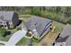 Beautiful home with landscaped yard, two-car garage, deck, and gray shingle roof nestled in a lovely wooded neighborhood at 5320 Northview Lk, Cumming, GA 30040