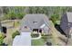 Aerial view of home featuring manicured lawn, mature trees, and inviting curb appeal at 5320 Northview Lk, Cumming, GA 30040