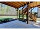 A backyard featuring a grassy lawn and a raised deck with wood support beams at 5320 Northview Lk, Cumming, GA 30040