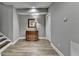 Finished basement with a charming dresser, art, and luxury vinyl plank flooring at 5320 Northview Lk, Cumming, GA 30040