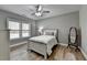 Charming bedroom with a cozy bed, a large window, and neutral tones that create a relaxing atmosphere at 5320 Northview Lk, Cumming, GA 30040