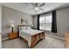 Cozy bedroom with a ceiling fan, neutral walls, and natural light from a window at 5320 Northview Lk, Cumming, GA 30040
