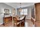 Elegant dining room with hardwood floors, a decorative chandelier, and classic furnishings at 5320 Northview Lk, Cumming, GA 30040