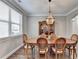 Dining room with hardwood floors, pendant lighting, and neutral colors at 5320 Northview Lk, Cumming, GA 30040