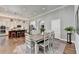 Stylish dining area situated between the kitchen and a hallway at 5320 Northview Lk, Cumming, GA 30040