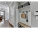 Inviting entryway with a bench, hooks for storage, and hardwood floors at 5320 Northview Lk, Cumming, GA 30040