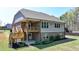 This home features a back deck, back patio, and well-maintained landscaping, creating an inviting outdoor living space at 5320 Northview Lk, Cumming, GA 30040