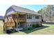 The home features a back deck with outdoor lighting perfect for evening relaxation and outdoor gatherings at 5320 Northview Lk, Cumming, GA 30040