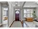 Welcoming foyer with hardwood floors, neutral walls, and a view into the bedroom at 5320 Northview Lk, Cumming, GA 30040