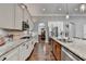 Well appointed kitchen with large island and granite countertops and stainless steel appliances at 5320 Northview Lk, Cumming, GA 30040
