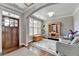 Cozy living room with large windows, hardwood floors, and stylish neutral decor at 5320 Northview Lk, Cumming, GA 30040