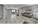 Expansive living area with a dining table and comfortable seating, creating an open and versatile living space at 5320 Northview Lk, Cumming, GA 30040