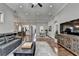 Open floor plan with a living room that flows into the dining room and kitchen featuring hardwood floors at 5320 Northview Lk, Cumming, GA 30040