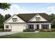 Charming single-Gathering home with a welcoming front porch and a two-car garage at 555 Southland Cir, Canton, GA 30115