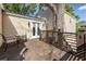 Wood deck featuring an outdoor table and chairs, wooden railing, and access to the home at 1010 Eden Se Ave, Atlanta, GA 30316