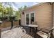 Cozy back deck featuring an outdoor table and chairs and access to the home via French doors at 1010 Eden Se Ave, Atlanta, GA 30316