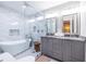 This luxurious bathroom features a double vanity, soaking tub, and a separate glass enclosed shower at 1010 Eden Se Ave, Atlanta, GA 30316