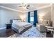 Comfortable bedroom features hardwood floors, ceiling fan, and a sitting area with a plush chair at 1010 Eden Se Ave, Atlanta, GA 30316