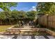 Backyard fire pit area with stone surround and chairs, ideal for relaxing evenings outdoors at 1010 Eden Se Ave, Atlanta, GA 30316