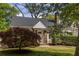 Cozy home with a lush front yard, featuring a beautiful Japanese maple and a stone-accented entryway at 1010 Eden Se Ave, Atlanta, GA 30316