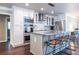 Well-equipped kitchen with an island, bar stools, sleek countertops, and stainless steel appliances at 1010 Eden Se Ave, Atlanta, GA 30316
