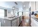 Spacious kitchen featuring an island with sink, stainless steel appliances, and an open view into the living area at 1010 Eden Se Ave, Atlanta, GA 30316