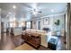 Open-concept living room with hardwood floors, a ceiling fan, and seamless flow into the kitchen area at 1010 Eden Se Ave, Atlanta, GA 30316