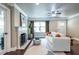 Well-lit living room featuring a white fireplace, neutral decor, and hardwood flooring at 1010 Eden Se Ave, Atlanta, GA 30316