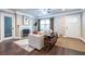 Bright living room with a decorative fireplace, hardwood floors, and a stylish neutral sofa at 1010 Eden Se Ave, Atlanta, GA 30316