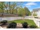A well-manicured lawn is fully enclosed with a white picket fence at 1911 Commons Cir, Brookhaven, GA 30341
