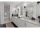 Bathroom featuring double sinks, a large mirror, and a glass-enclosed shower at 1911 Commons Cir, Brookhaven, GA 30341