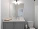 Clean bathroom with a vanity, sink, and toilet at 1911 Commons Cir, Brookhaven, GA 30341