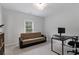 Bedroom with a window, a brown futon, a black desk and a rolling office chair at 1911 Commons Cir, Brookhaven, GA 30341