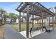 Inviting community space featuring shaded seating areas, benches, landscaped pathways, and charming neighborhood homes at 1911 Commons Cir, Brookhaven, GA 30341