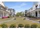 A beautiful view of community lawns and walkways with attractive homes on either side at 1911 Commons Cir, Brookhaven, GA 30341