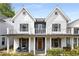 Charming two-story home with a covered front porch and balcony, offering inviting curb appeal at 1911 Commons Cir, Brookhaven, GA 30341
