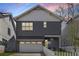 Modern two-story home with a gray exterior, white trim, and an attached garage at 1911 Commons Cir, Brookhaven, GA 30341