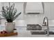 Close up of a well-equipped kitchen with stainless steel appliances and white subway tile backsplash at 1911 Commons Cir, Brookhaven, GA 30341