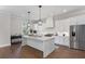 Modern kitchen featuring stainless steel appliances, a large island, and ample counter space at 1911 Commons Cir, Brookhaven, GA 30341