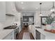 Open kitchen with stainless steel appliances and a view of the dining area at 1911 Commons Cir, Brookhaven, GA 30341