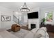 Cozy living area with fireplace, large-screen TV, and comfortable seating, perfect for relaxation at 1911 Commons Cir, Brookhaven, GA 30341
