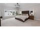 Spacious main bedroom with a large window and modern lighting at 1911 Commons Cir, Brookhaven, GA 30341