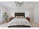 Well-lit main bedroom with a large bed, side tables, and decorative plants at 1911 Commons Cir, Brookhaven, GA 30341