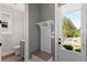 Mudroom with coat rack, storage bench, and access to the backyard at 1911 Commons Cir, Brookhaven, GA 30341